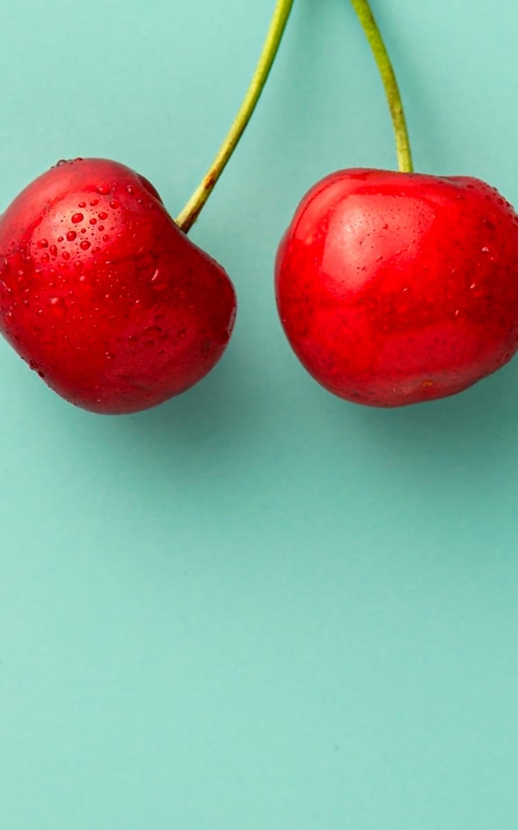 two fresh red cherries